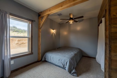 post-and-beam-bedroom-with-exposed-beam